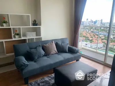 Modern living room with city view from balcony, stylish sofa and shelving unit.