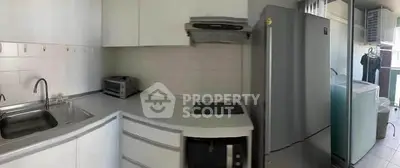 Modern kitchen with sleek appliances and ample storage space