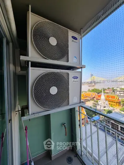Balcony with air conditioning units and city view