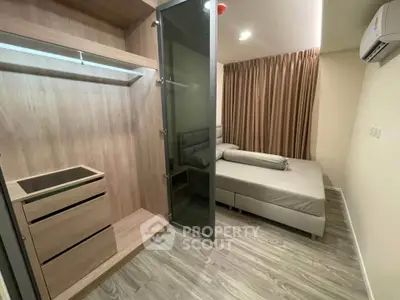 Modern bedroom with built-in wardrobe and sleek design