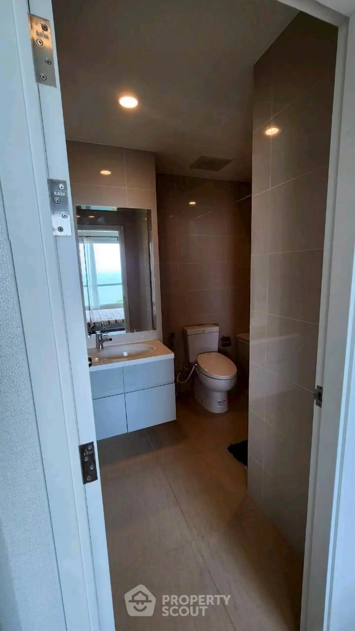 Modern bathroom with sleek fixtures and ocean view window