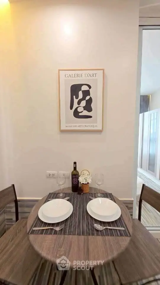 Cozy dining nook with modern decor and elegant table setting in a stylish apartment.