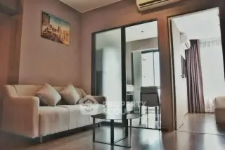 Modern living room with cozy sofa and air conditioning in stylish apartment.