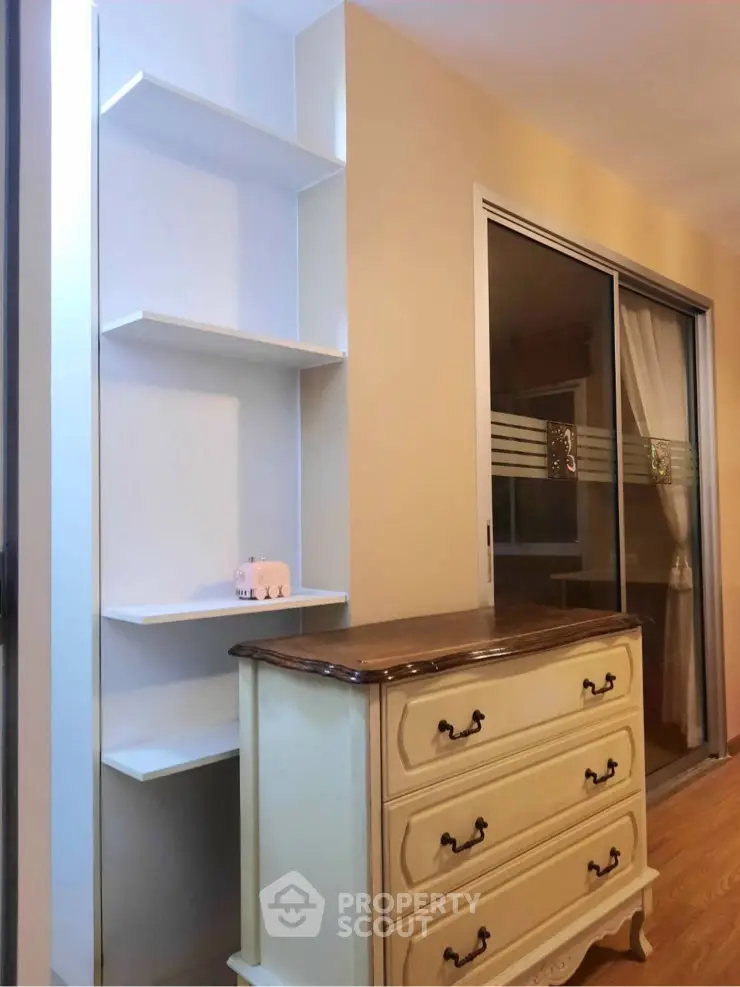 Charming interior with elegant dresser and modern shelving in cozy living space.