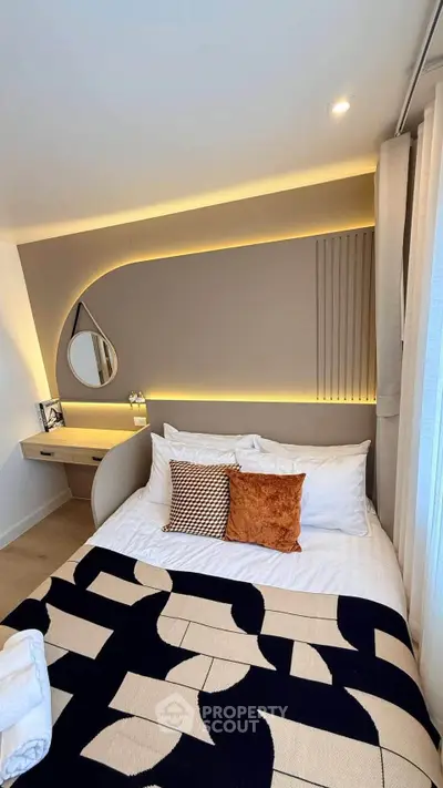 Stylish modern bedroom with cozy lighting and elegant decor, perfect for relaxation and comfort.