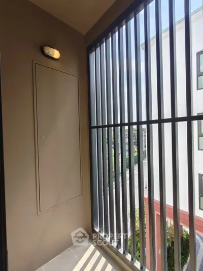 Modern balcony with sleek railing and urban view, perfect for city living.