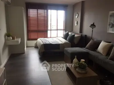 Modern studio apartment with cozy living area and stylish decor