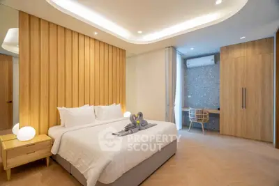 Luxurious modern bedroom with elegant wooden accents and ambient lighting, perfect for relaxation and comfort.