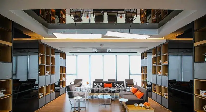 Modern living room with sleek design and floor-to-ceiling windows, featuring stylish furniture and built-in shelving.