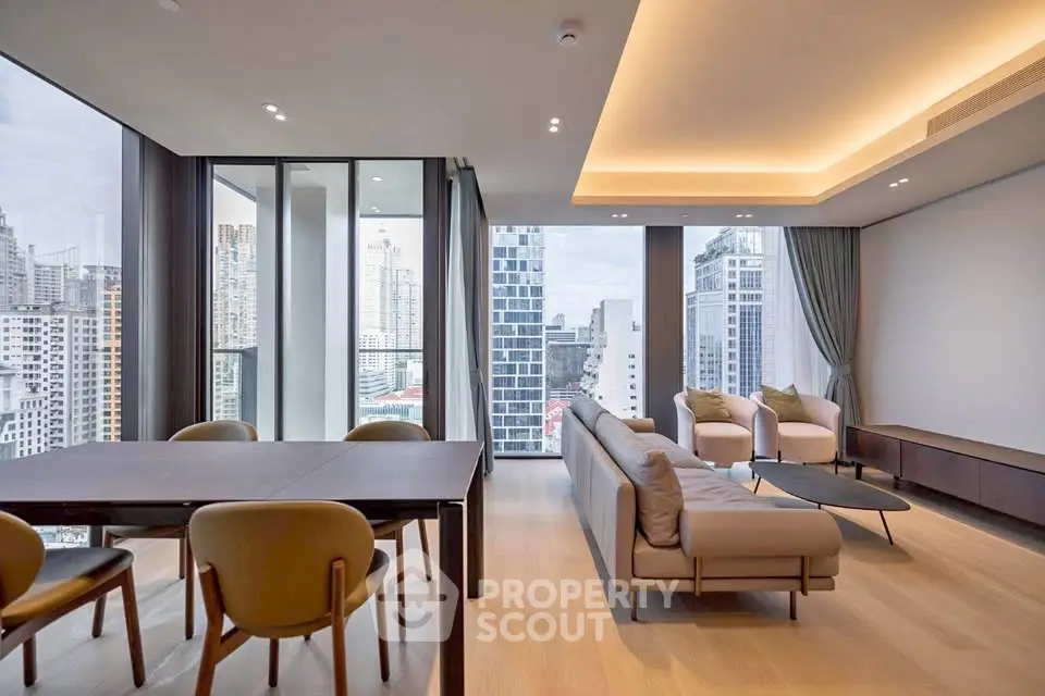 Luxurious modern living room with panoramic city views and elegant furnishings.