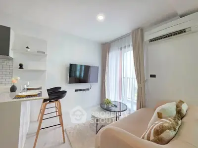 Modern living room with cozy sofa, wall-mounted TV, and stylish decor