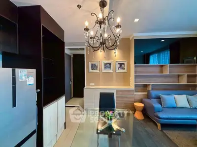 Stylish living room with elegant chandelier and modern furniture