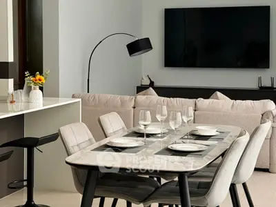 Modern living room with elegant dining area and sleek decor