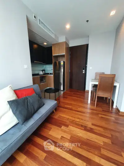 Modern apartment with open kitchen and stylish wooden flooring