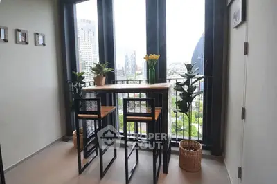 Chic urban balcony with modern seating and stunning city view, perfect for relaxation and entertaining.