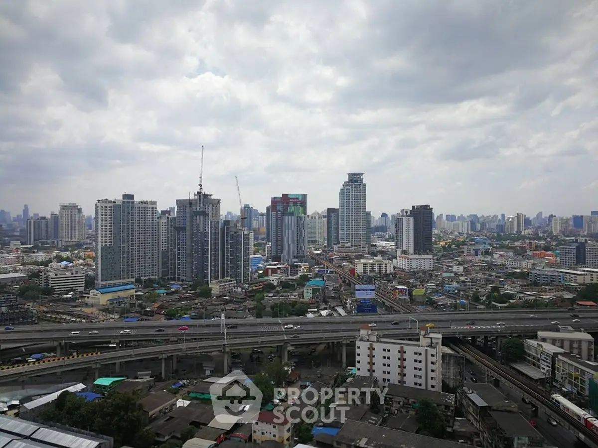 Stunning cityscape view showcasing modern skyscrapers and urban infrastructure under a cloudy sky.