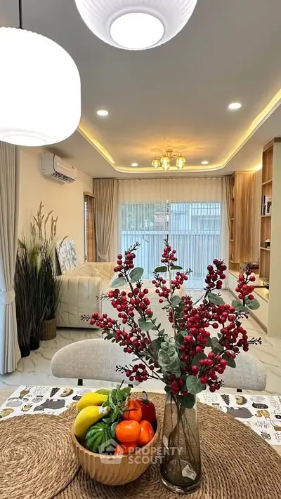 Elegant living room with modern decor and cozy ambiance, featuring a stylish dining area and natural light.