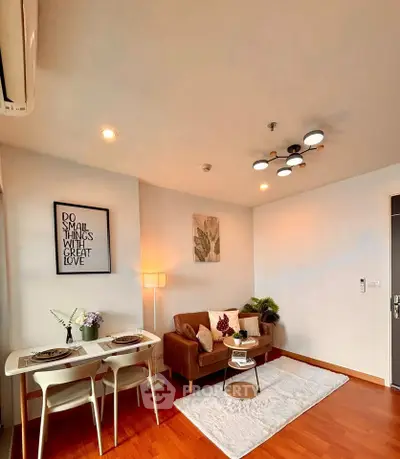 Charming living room with cozy seating and elegant decor, perfect for relaxation and entertaining.