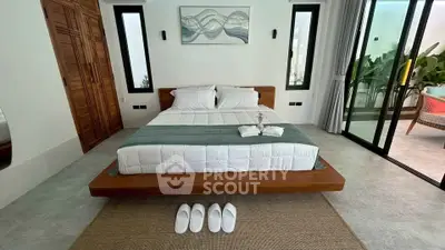 Luxurious bedroom with modern decor and private balcony access