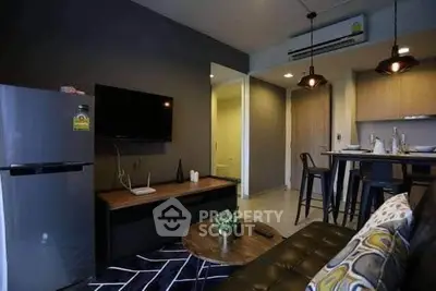 Modern living room with sleek furniture and open kitchen layout