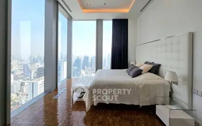 Luxurious bedroom with panoramic city view and elegant decor