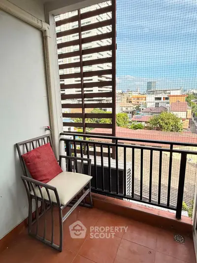 Charming balcony with city view, perfect for relaxation and enjoying the outdoors.