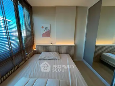 Modern bedroom with large window and stylish decor