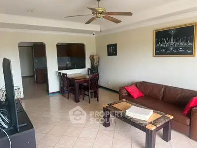 Spacious living room with elegant decor and open kitchen layout, perfect for modern living.