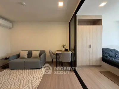 Modern studio apartment with cozy living area and stylish decor