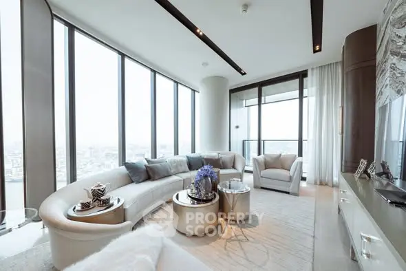 Luxurious modern living room with panoramic city views and elegant furnishings.