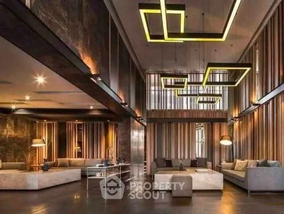 Luxurious modern living room with high ceilings and stylish lighting fixtures.