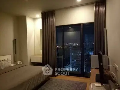 Modern bedroom with city view, featuring sleek design and cozy ambiance for urban living.