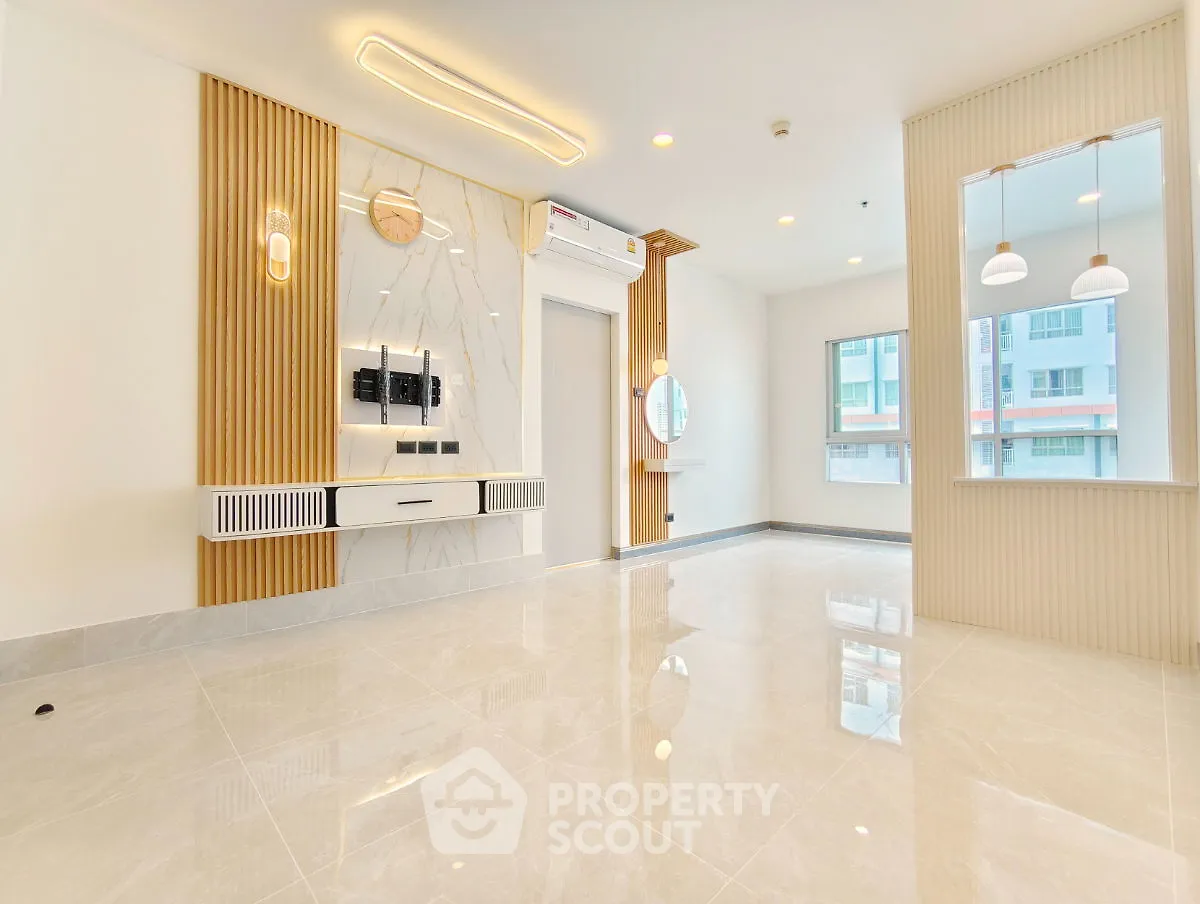 Modern living room with elegant design and ample natural light