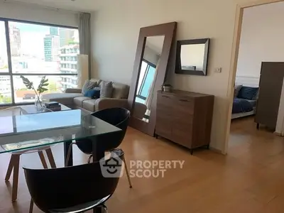 Modern living room with glass dining table and city view