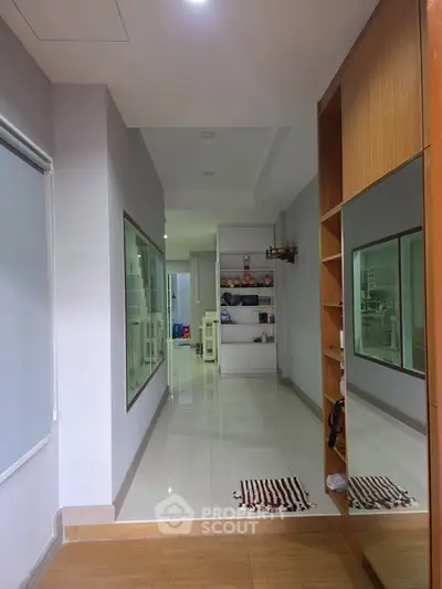 Spacious hallway with modern design and ample storage space, perfect for contemporary living.