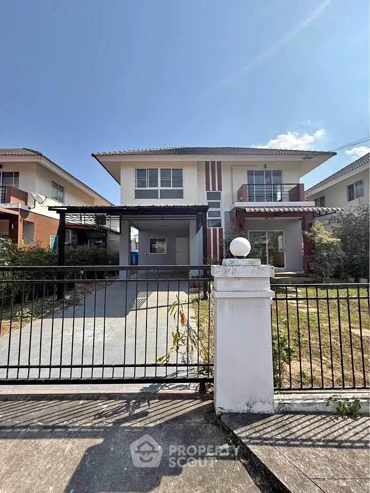 Charming two-story house with spacious driveway and modern design in a serene neighborhood.