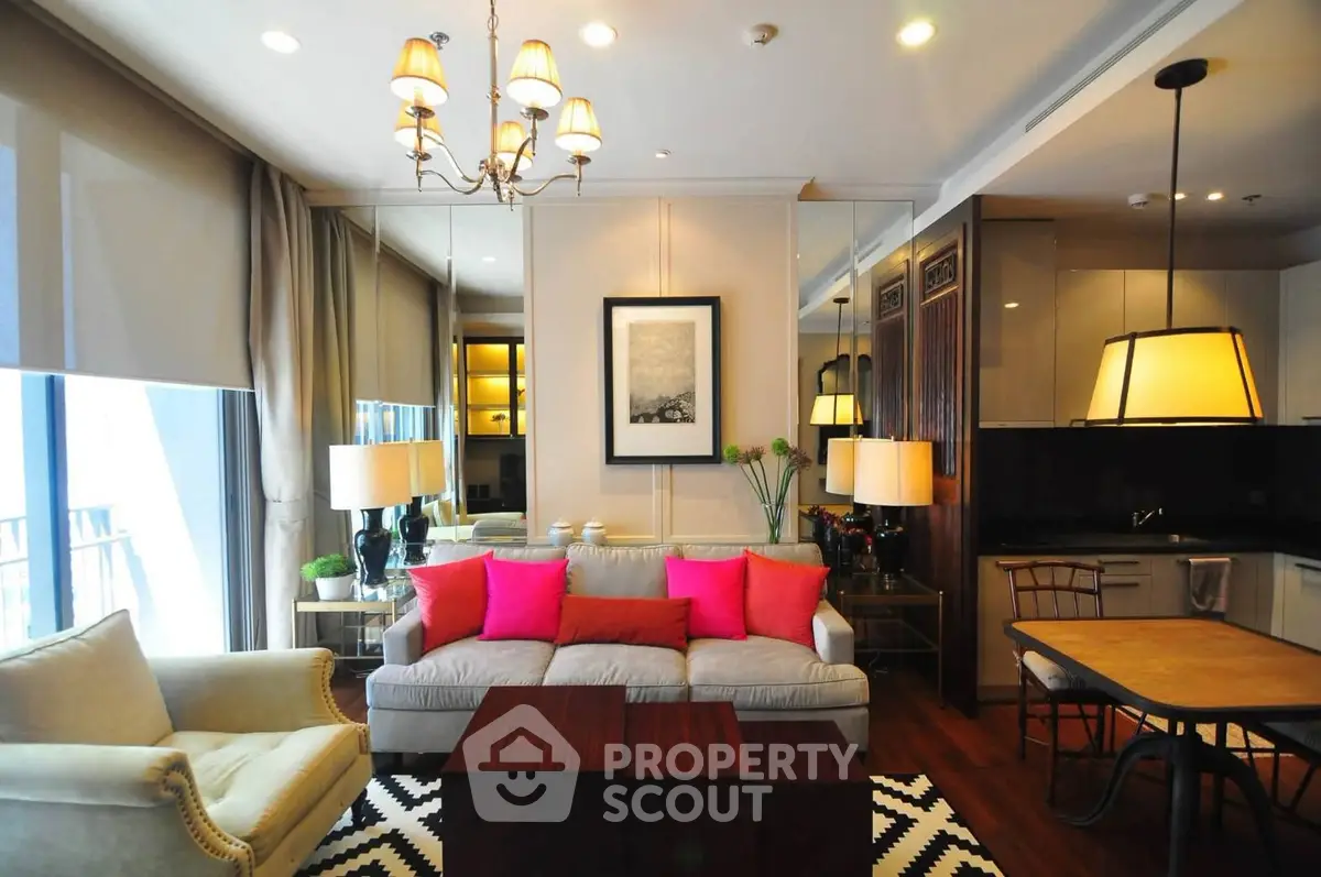 Luxurious living room with elegant decor and open kitchen layout in modern apartment.