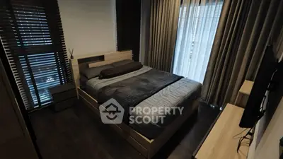 Modern bedroom with stylish decor and natural light