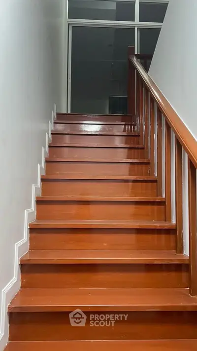 Elegant wooden staircase with polished finish in modern home