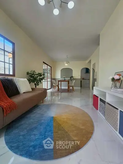 Spacious living room with modern decor and natural light