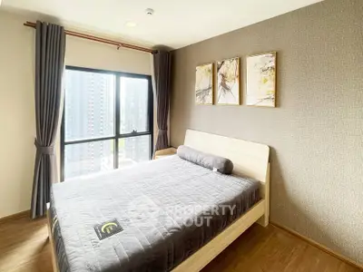 Modern bedroom with large window and stylish decor in urban apartment