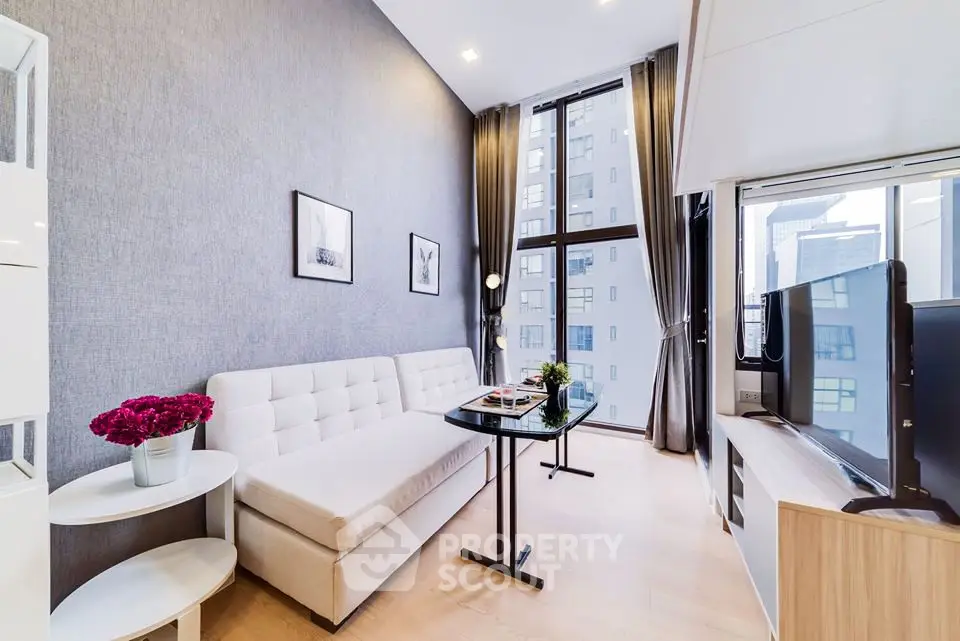 Modern living room with large windows and stylish decor in urban apartment