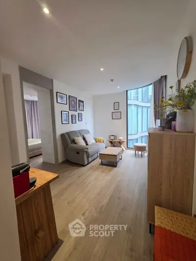 Modern living room with stylish decor and natural light in a contemporary apartment.