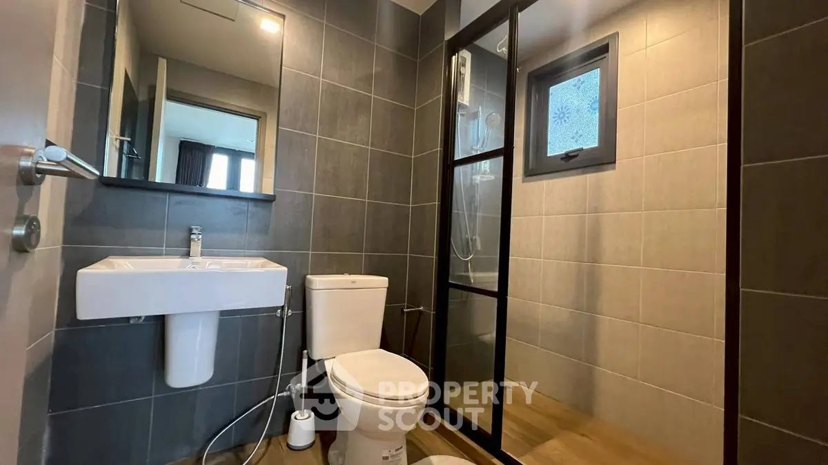 Modern bathroom with sleek design and glass shower enclosure