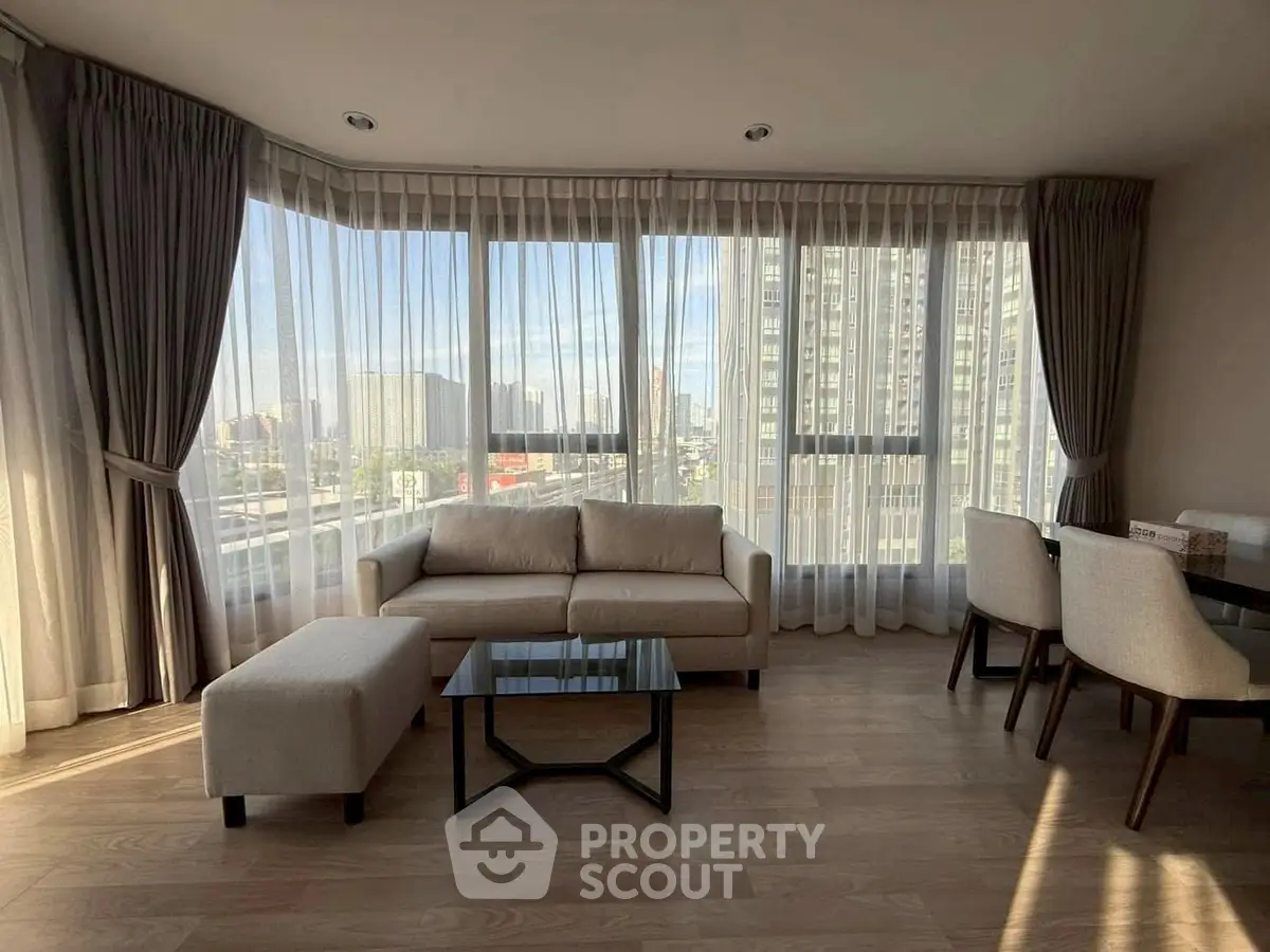 Spacious living room with panoramic windows and modern furniture