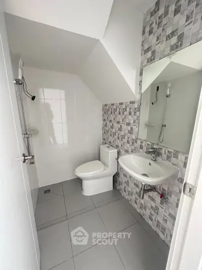 Modern bathroom with sleek design and tiled walls