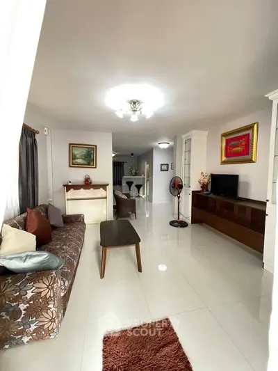 Spacious living room with elegant decor and ample natural light