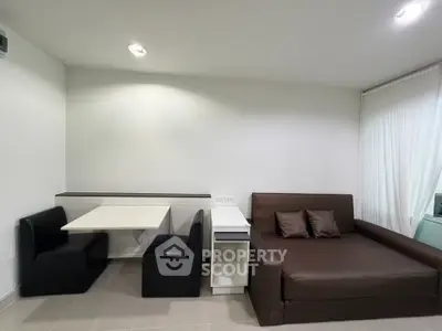 Modern living room with sleek furniture and cozy seating area