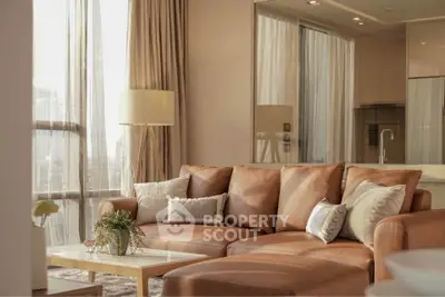 Luxurious living room with elegant leather sofa and floor-to-ceiling windows offering stunning city views.