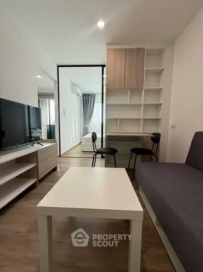 Modern living room with sleek furniture and open layout, perfect for urban living.
